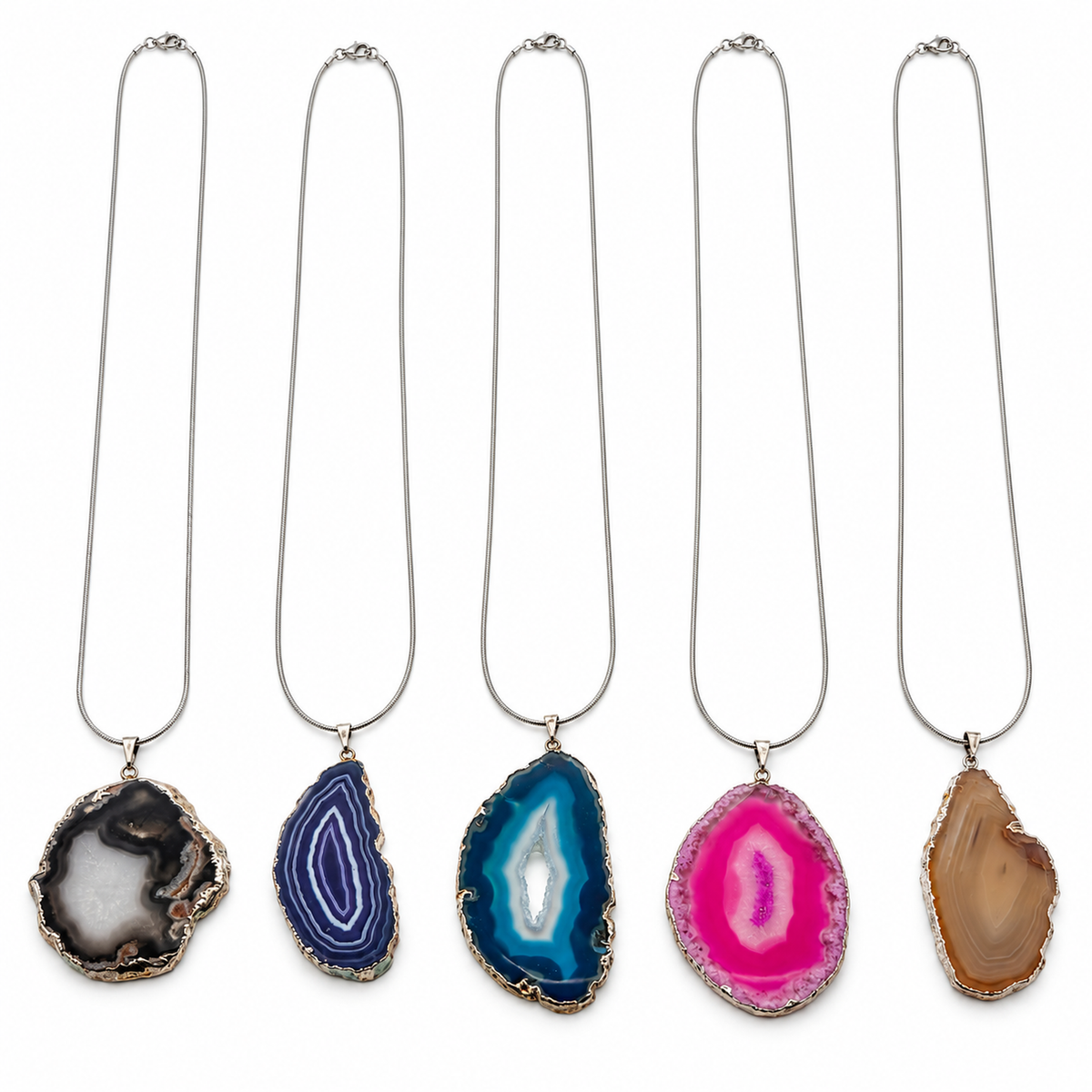 Five real agate slice pendants side by side showing gray-black, purple, blue, pink, and brown and differences in size